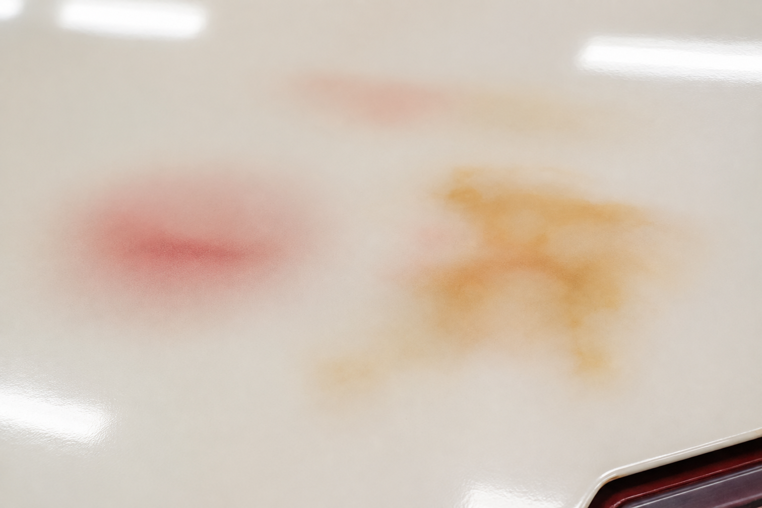 Bleeding and staining coating defect